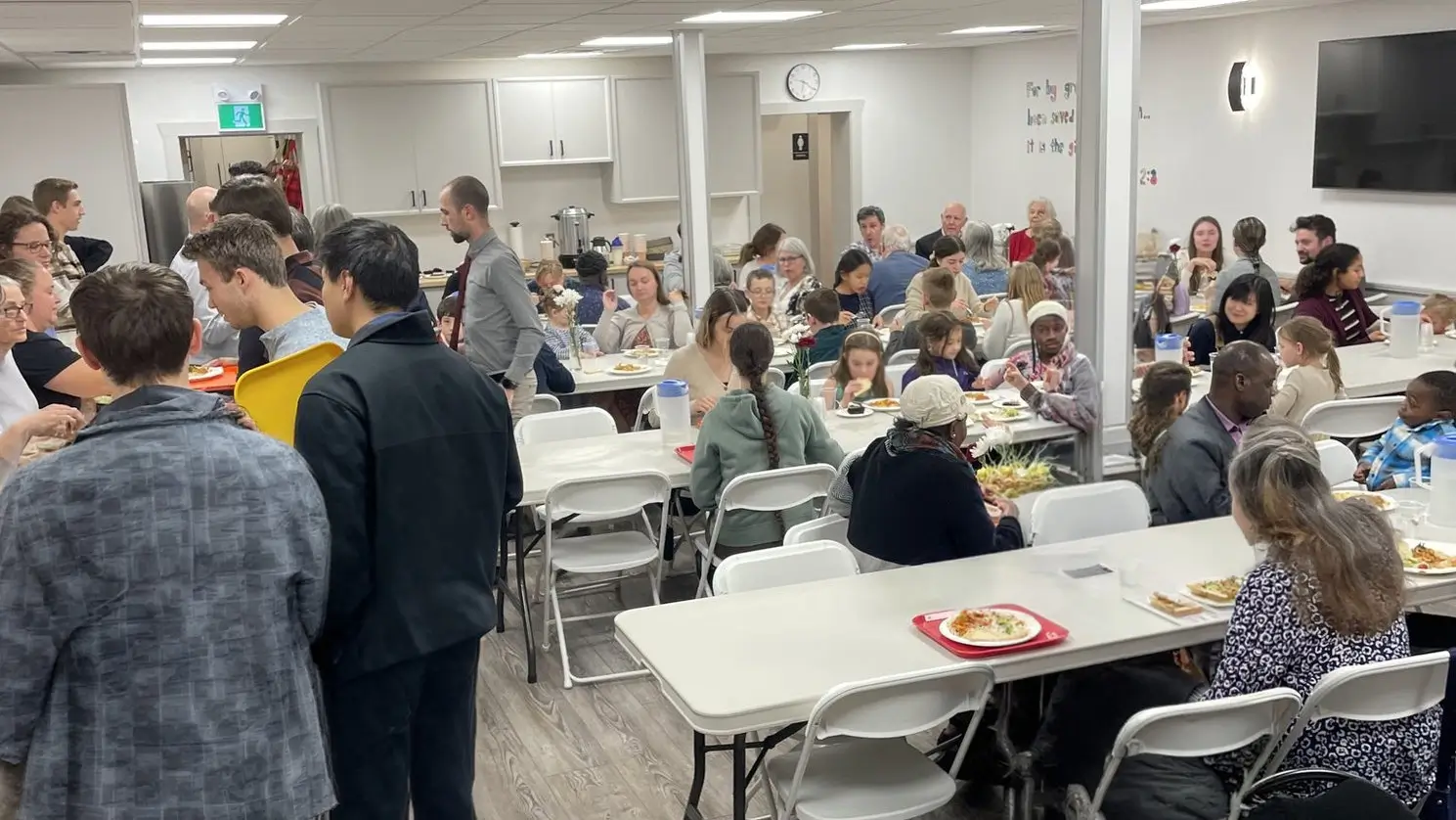 People sharing a meal at a past community gospel supper.