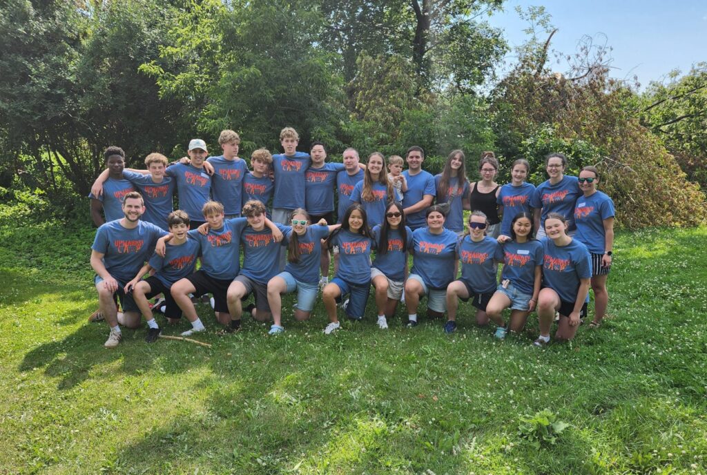 Upwards! Camp volunteers and staff gathered for a group photo
